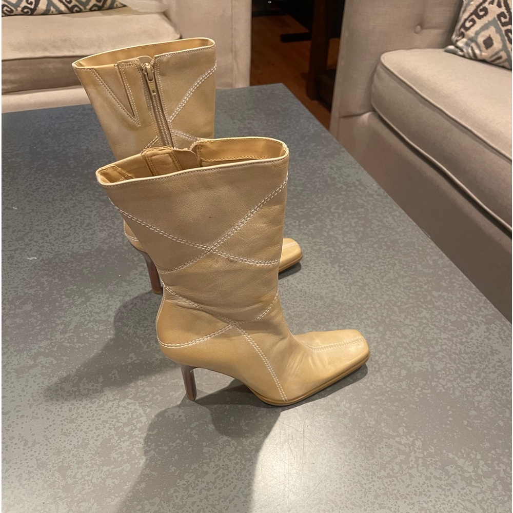 BP. Cream-colored heeled boots.